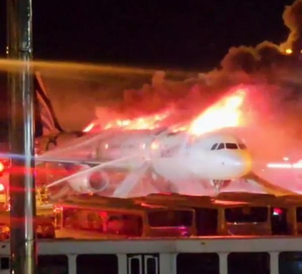 Firefighters extinguish a fire in the fuselage of an Air Busan aircraft bound for Hong Kong at Gimhae Airport, Jan. 28. Yonhap